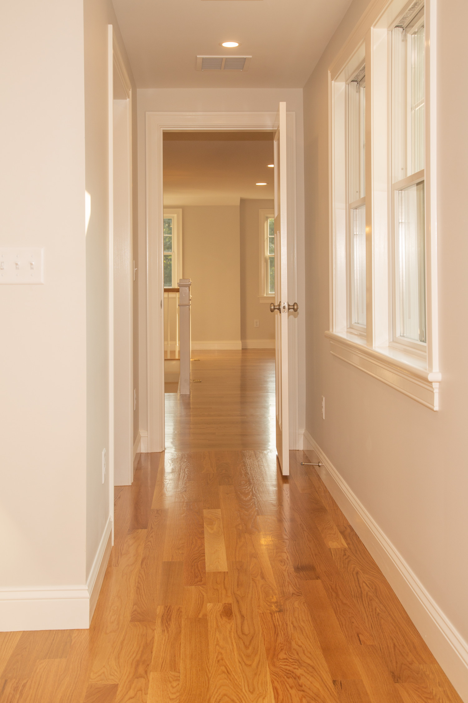 Hallway with wood flooring on second floor