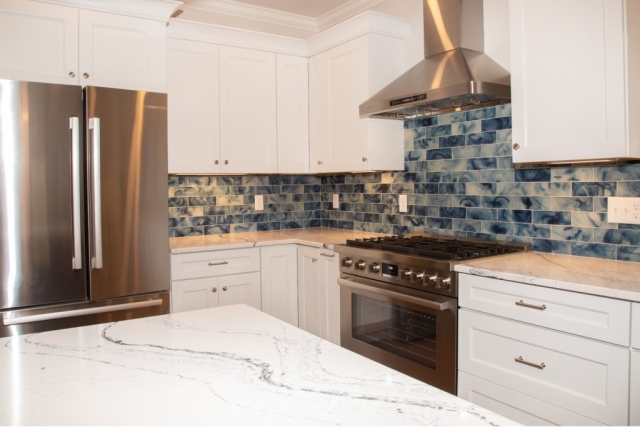 Kitchen granite countertops, tiling, stainless steel appliances