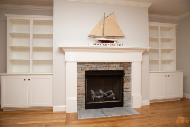 Fireplace and built-in shelves in living area
